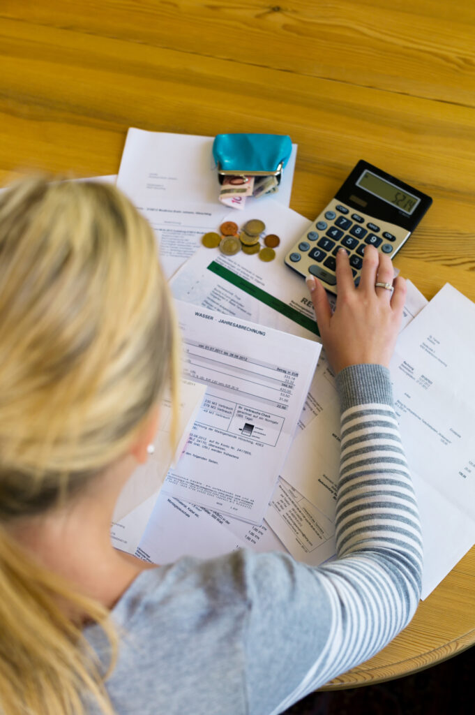 woman calculating debt